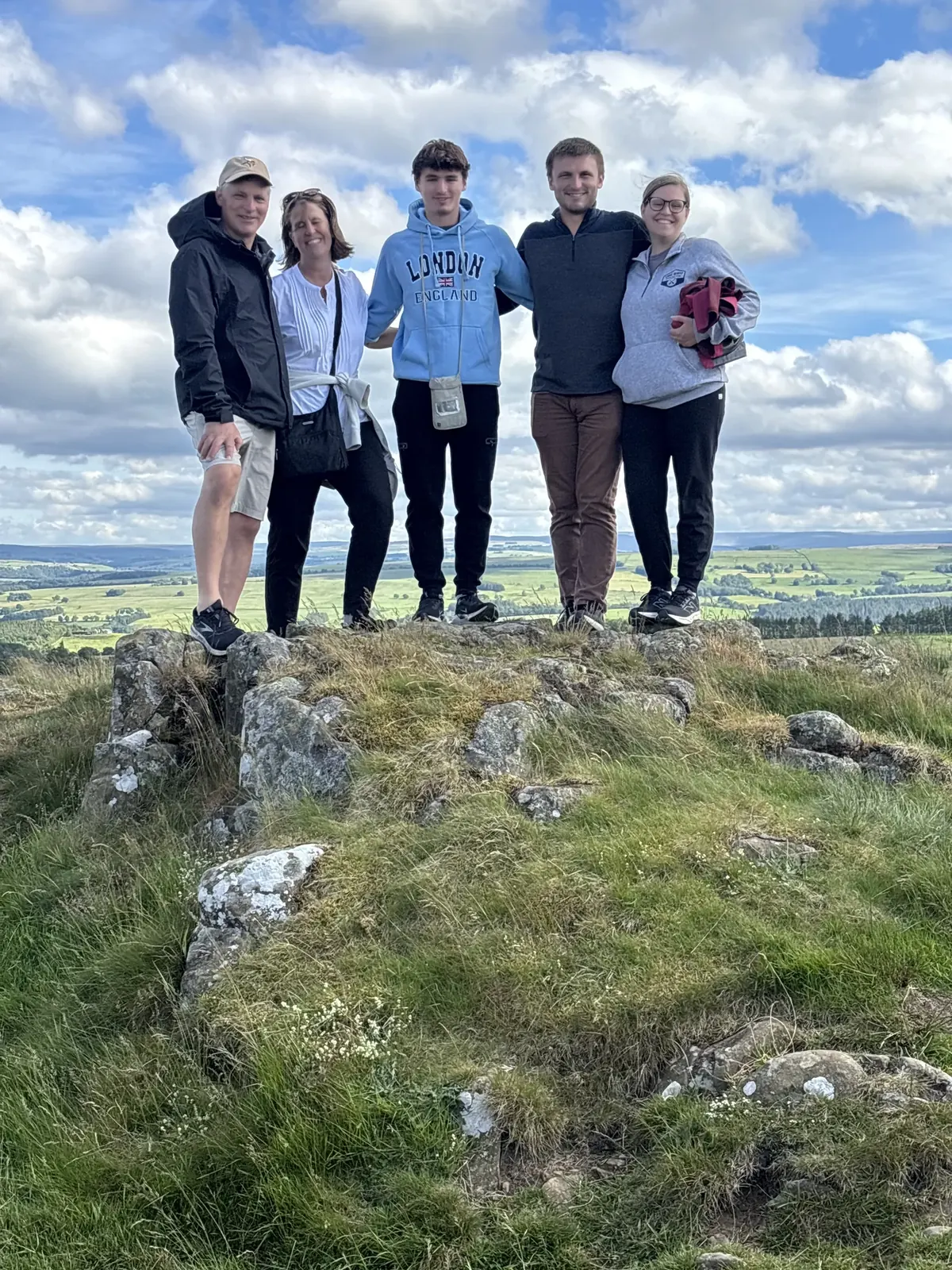 Guests on a scenic stop during a private Edinburgh to York chauffeur transfer tour